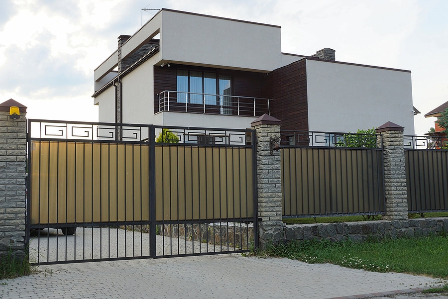 big house with metal gate